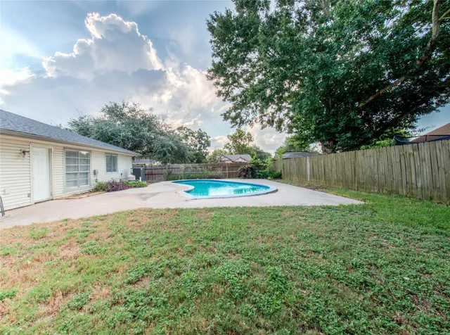 a view of backyard with a small cabin