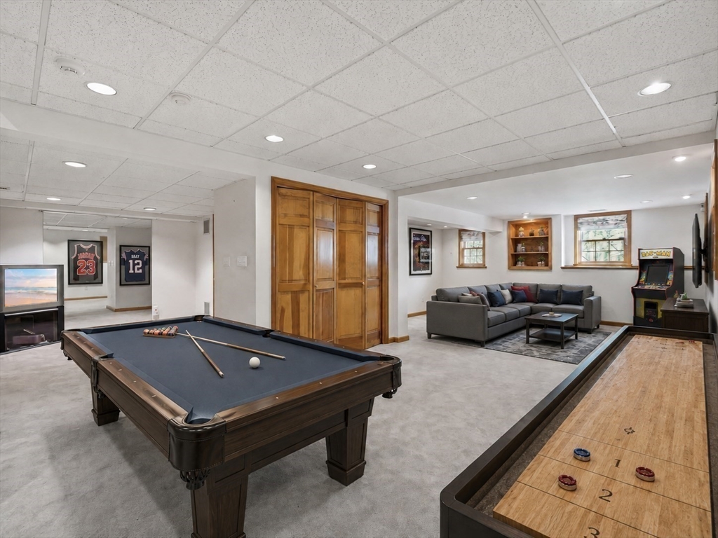 10 Hawk Ridge Road Andover, MA 01810 - Photo 27 of 32 a living room with furniture pool table and a flat screen tv