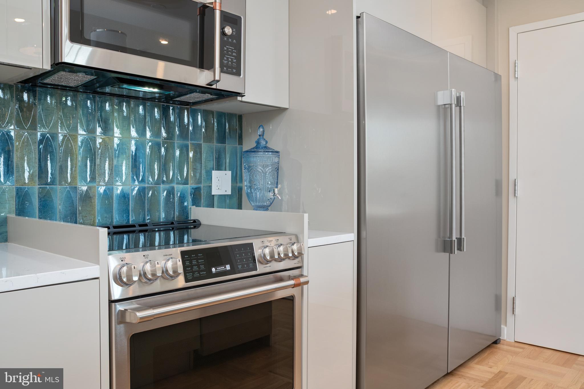 10339 Old Georgetown Road, Unit 516 Bethesda, MD 20814 - Photo 13 of 44 a kitchen with a stove and a microwave