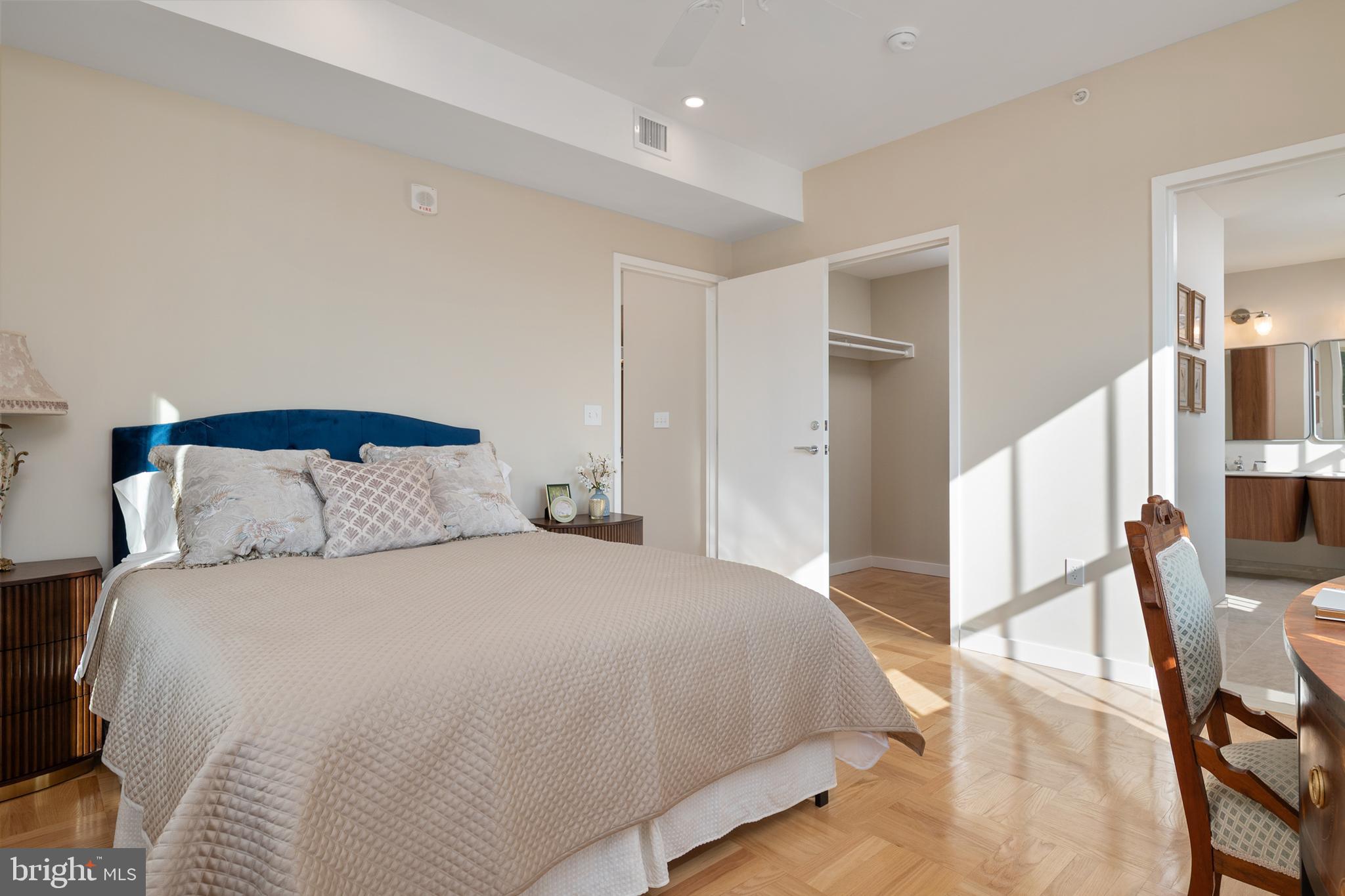 10339 Old Georgetown Road, Unit 516 Bethesda, MD 20814 - Photo 23 of 44 a bedroom with a bed and large mirror