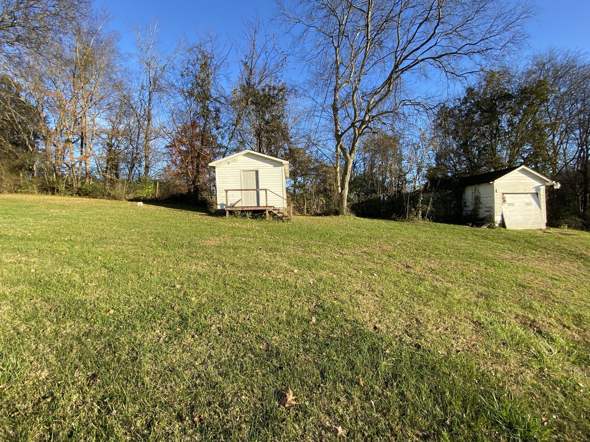 1666 Rock Products Road Columbia, TN 38401 - Photo 22 of 22 a white house that has a tree in front of it