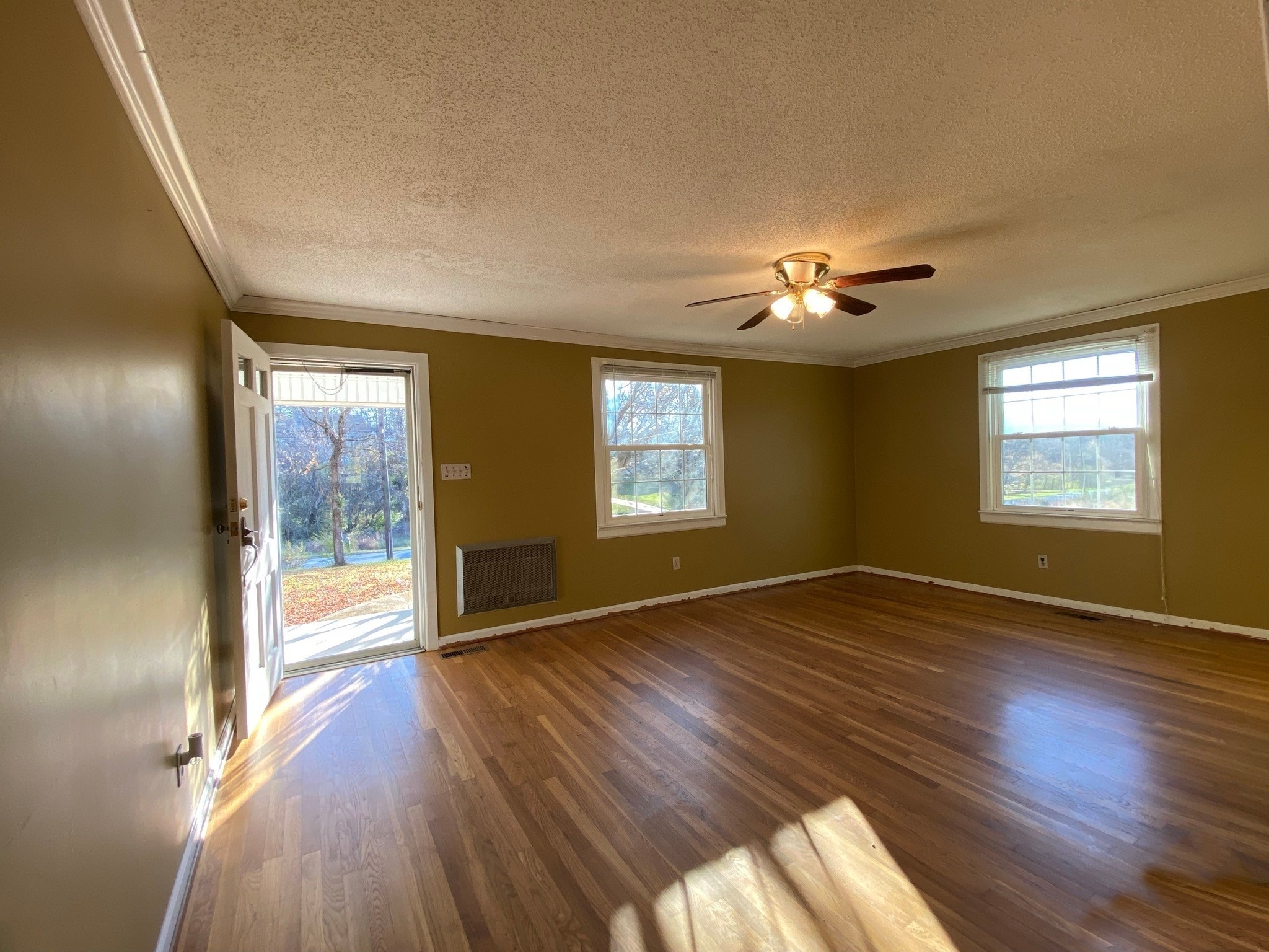 1666 Rock Products Road Columbia, TN 38401 - Photo 4 of 22 a view of an empty room with a window and wooden floor