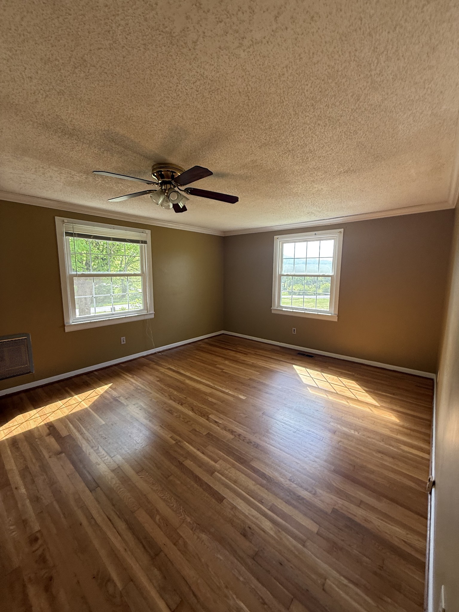 1666 Rock Products Road Columbia, TN 38401 - Photo 6 of 22 a view of empty room with wooden floor and fan