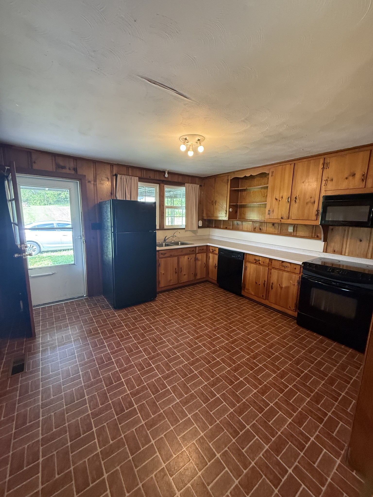 1666 Rock Products Road Columbia, TN 38401 - Photo 7 of 22 a kitchen with stainless steel appliances granite countertop a refrigerator and a sink