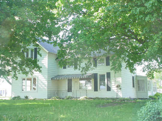 9432 East Scott Road Stillman Valley, IL 61084 - Photo 1 of 6 front view of a house with a yard