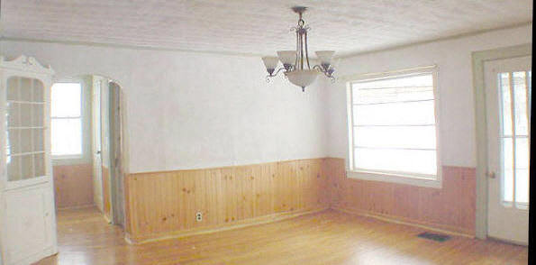 9432 East Scott Road Stillman Valley, IL 61084 - Photo 4 of 6 a view of empty room with wooden floor and fan