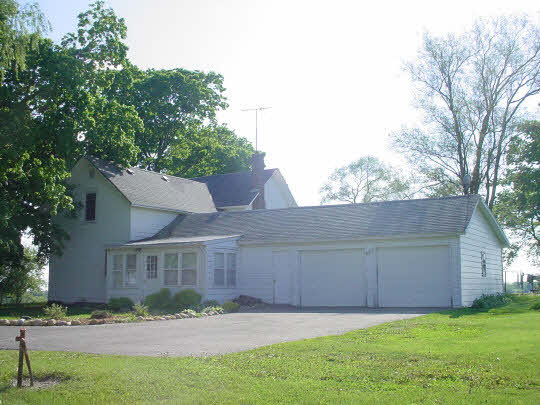 9432 East Scott Road Stillman Valley, IL 61084 - Photo 5 of 6 a view of a yard in front of a house