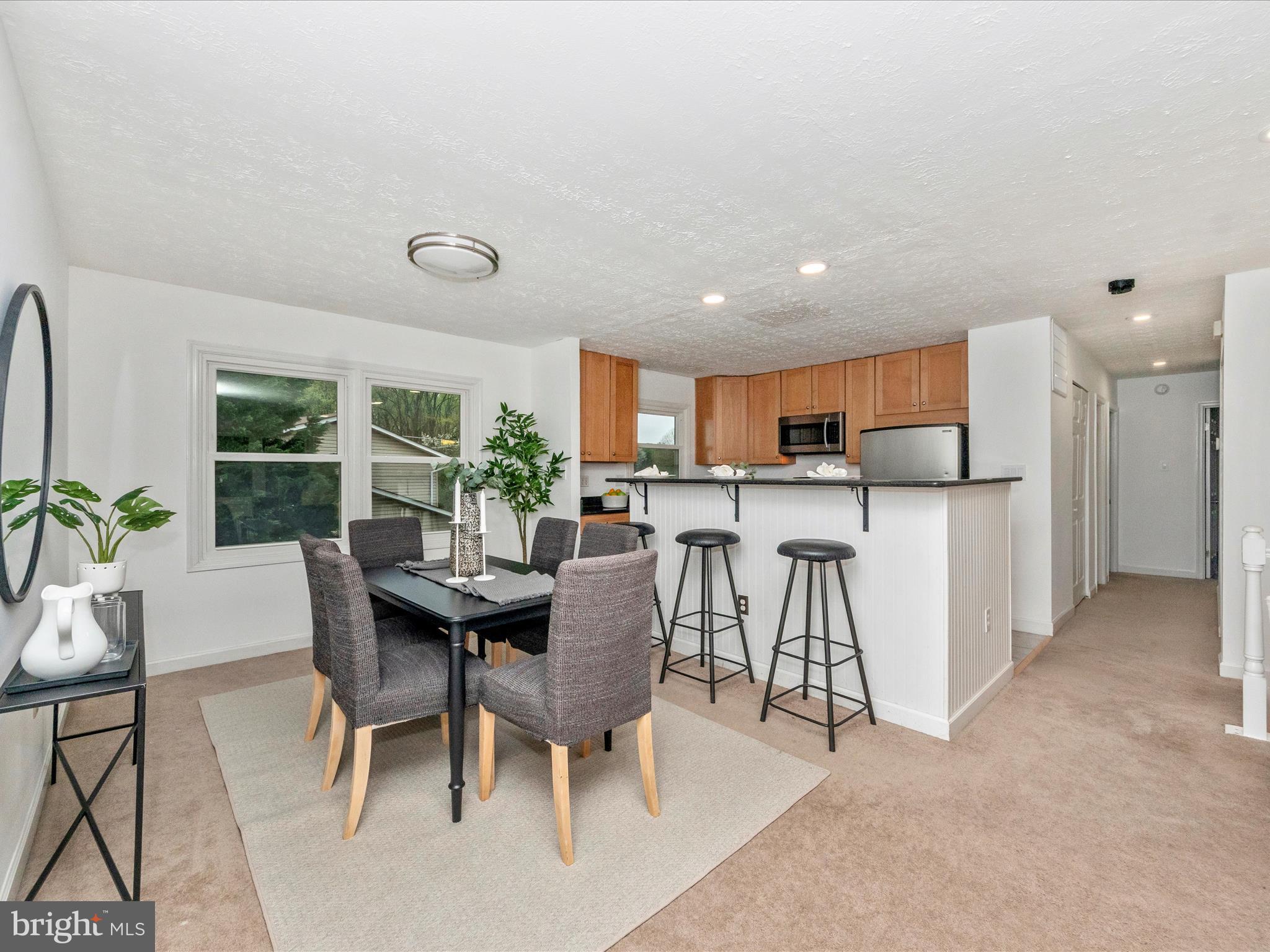 1825 Montreal Road Severn, MD 21144 - Photo 11 of 51 a view of a dining room with furniture window and wooden floor
