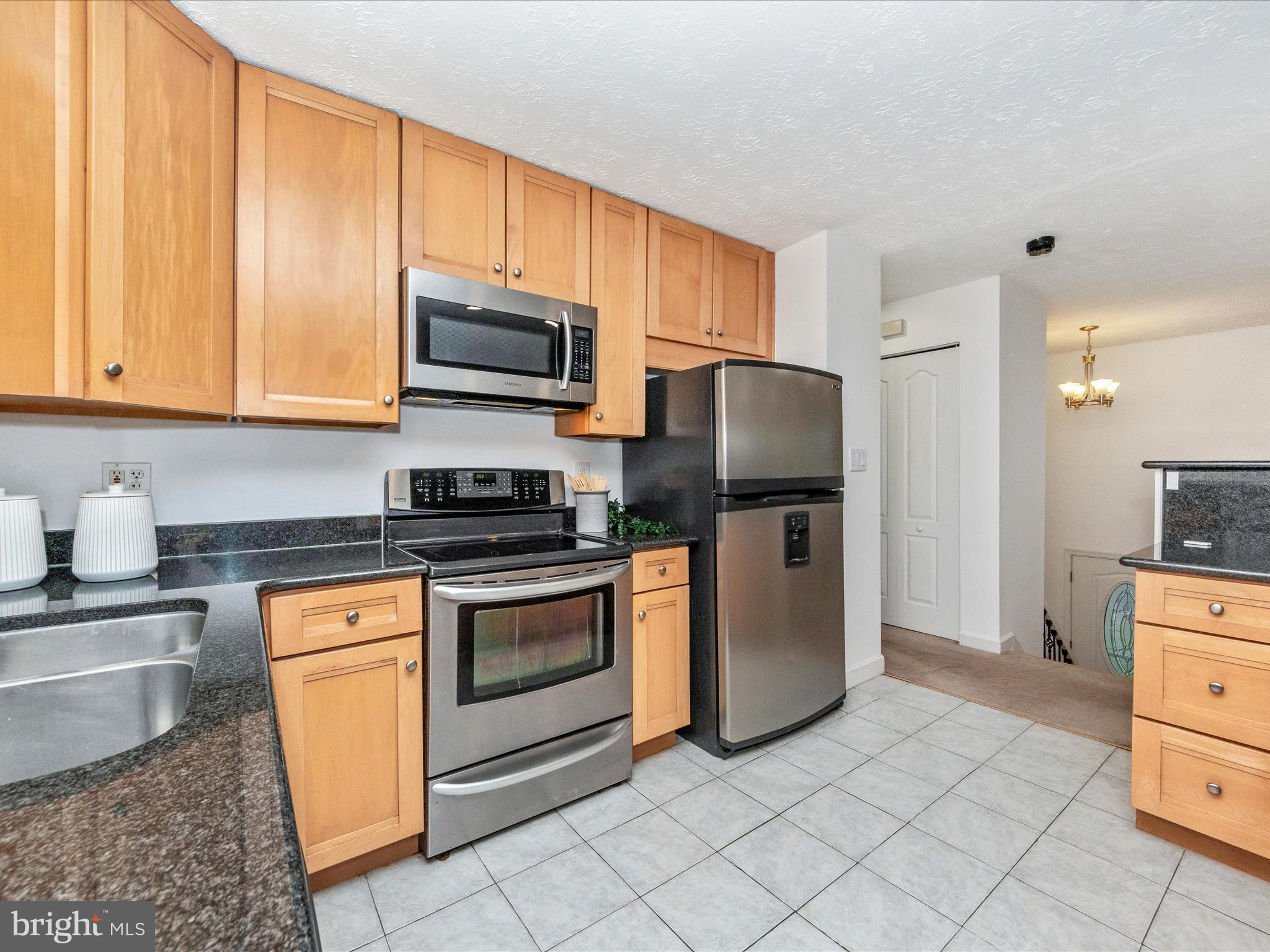 1825 Montreal Road Severn, MD 21144 - Photo 16 of 51 a kitchen with a sink stove and refrigerator