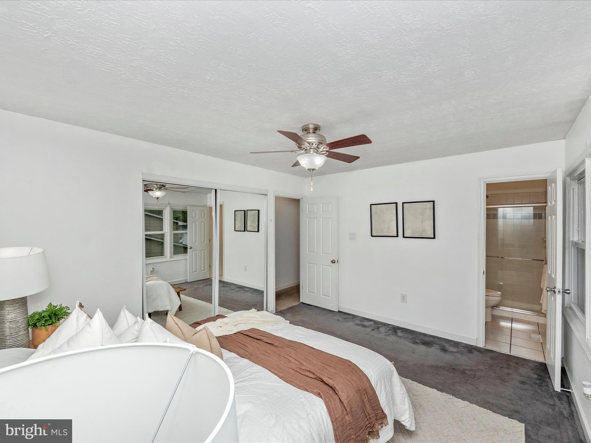 1825 Montreal Road Severn, MD 21144 - Photo 24 of 51 a bedroom with a bed and a chandelier