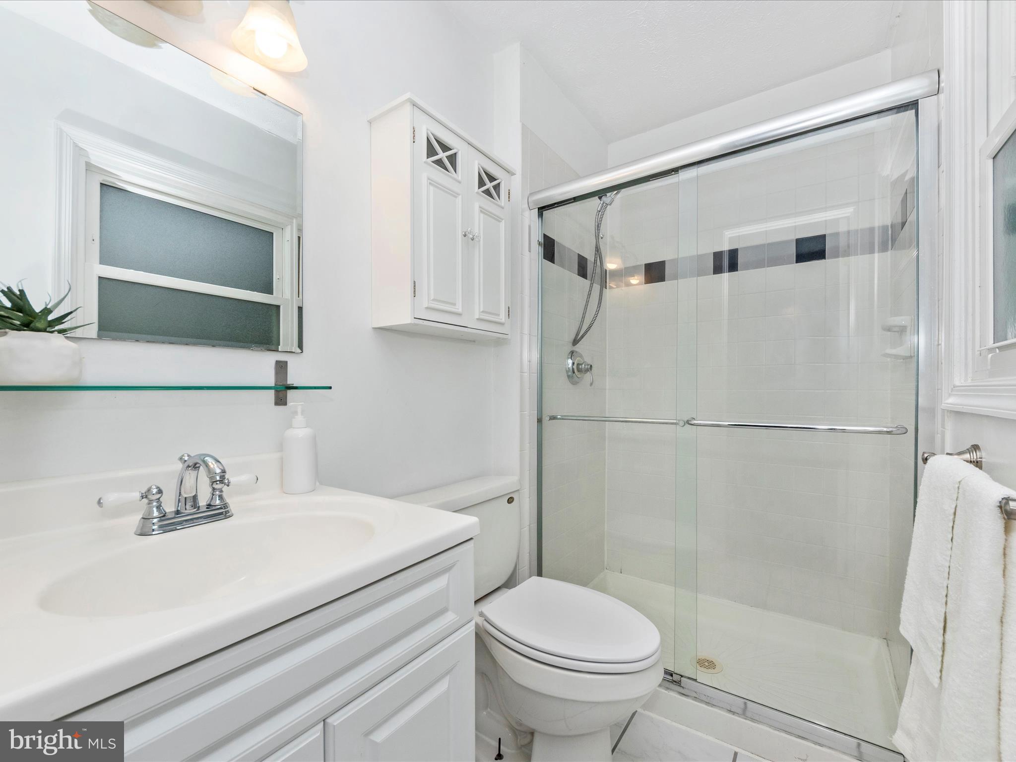 1825 Montreal Road Severn, MD 21144 - Photo 25 of 51 a bathroom with a sink toilet and shower