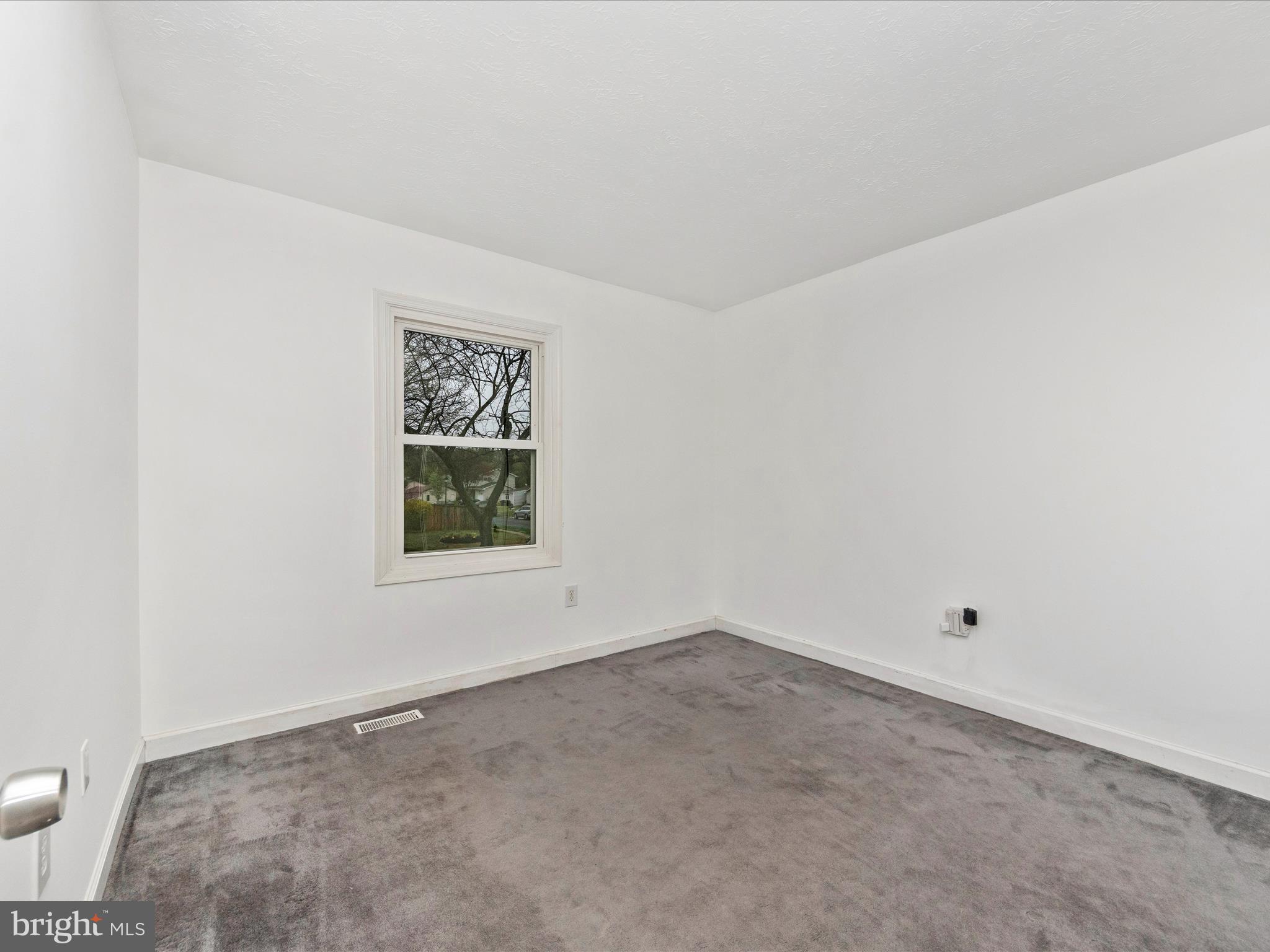 1825 Montreal Road Severn, MD 21144 - Photo 29 of 51 a view of an empty room with a window