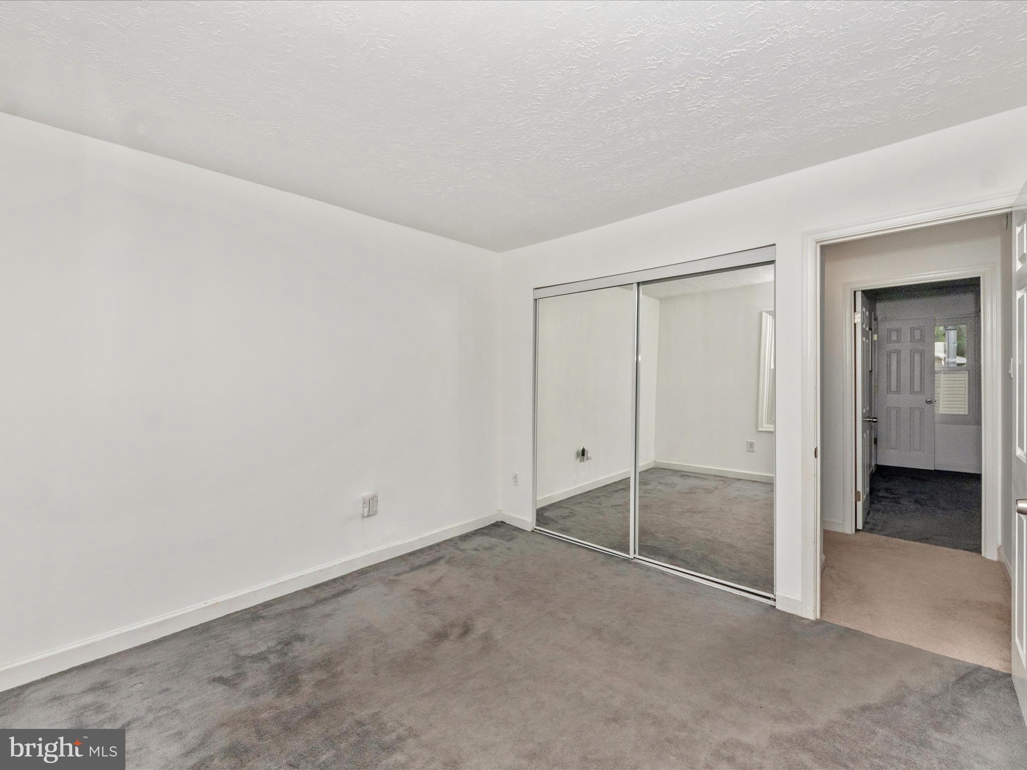 1825 Montreal Road Severn, MD 21144 - Photo 31 of 51 an empty room with sliding glass door