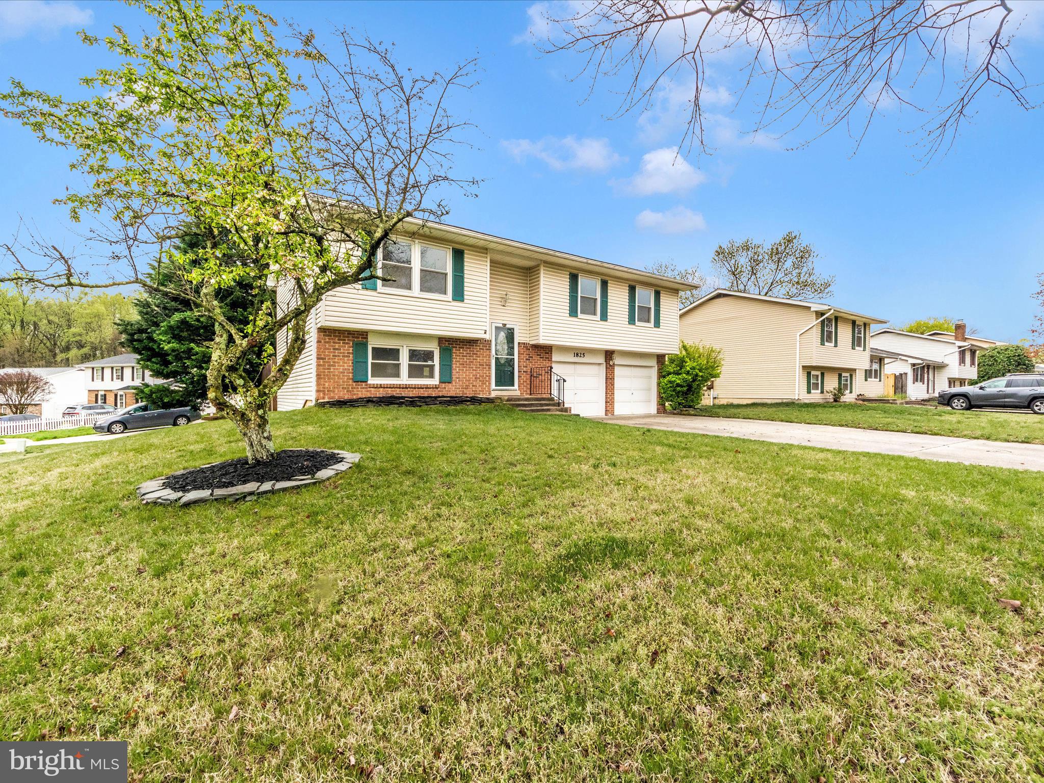 1825 Montreal Road Severn, MD 21144 - Photo 50 of 51 a front view of a house with a yard