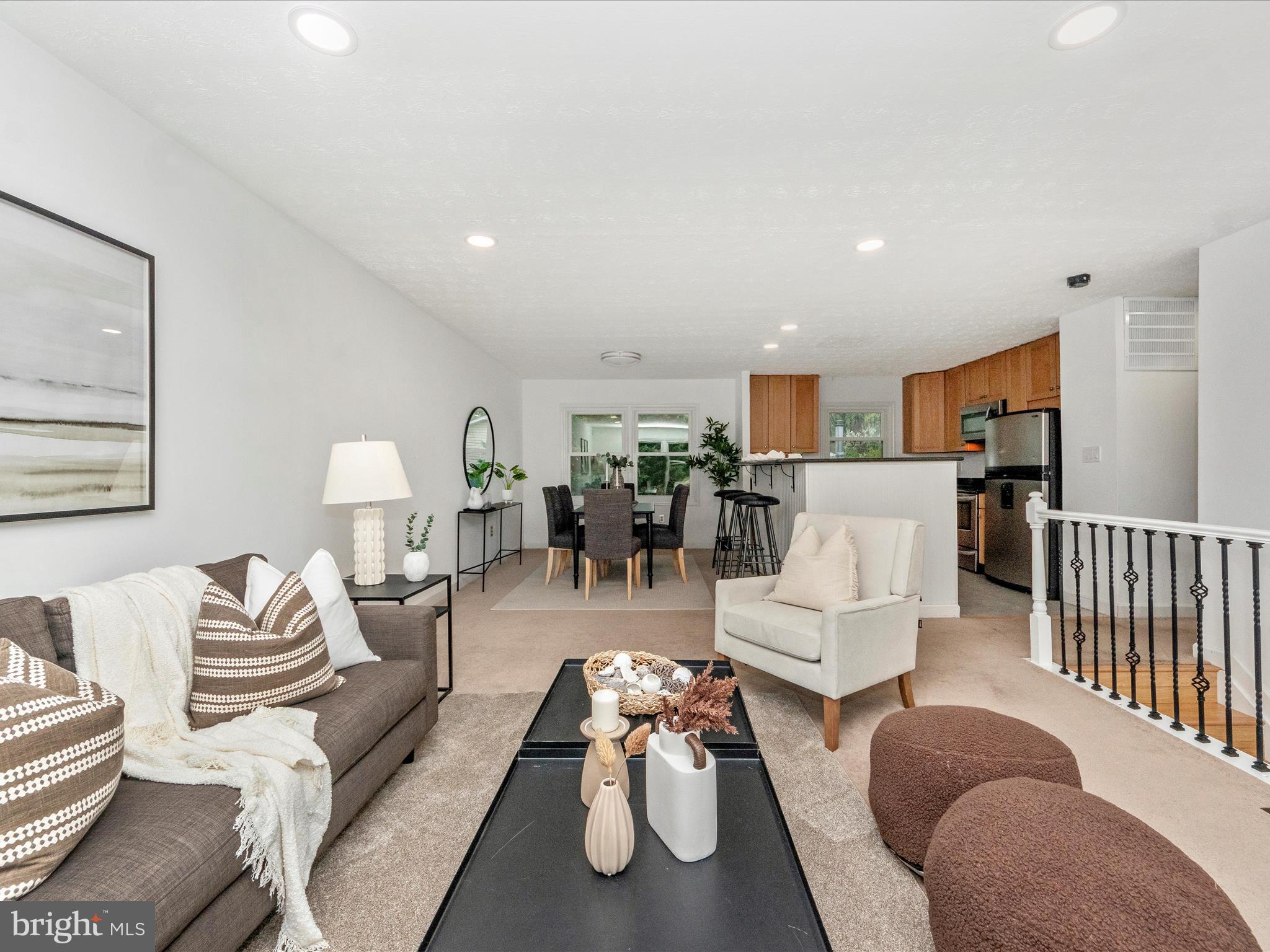 1825 Montreal Road Severn, MD 21144 - Photo 5 of 51 a living room with furniture white walls and wooden floor