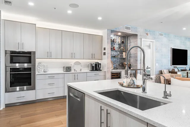 a view of a livingroom with furniture and a flat screen tv
