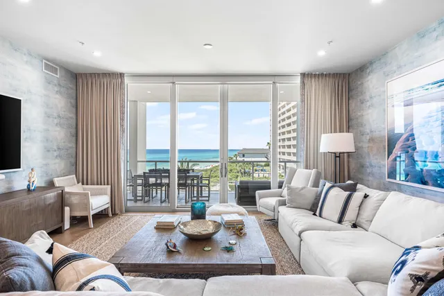 a view of swimming pool with outdoor seating and city view