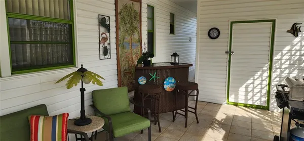 a backyard of a house with outdoor seating