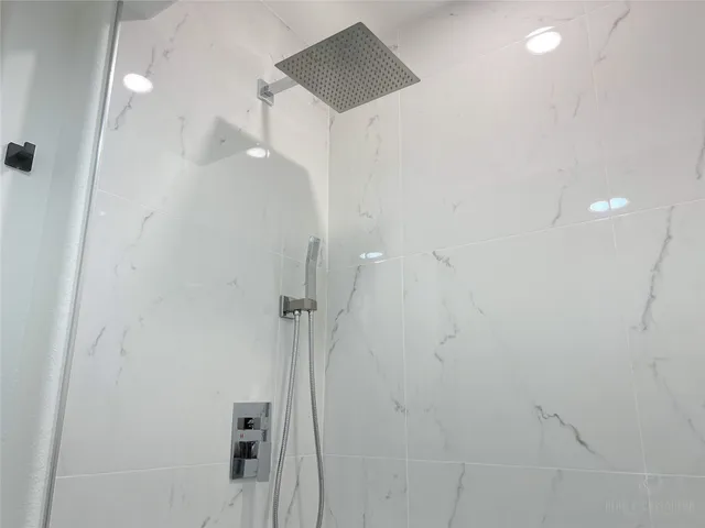 a bathroom with a toilet a sink and a mirror