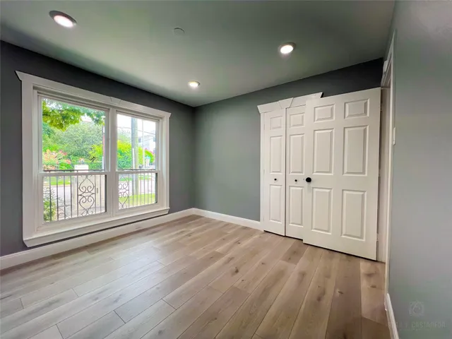 a bathroom with a sink mirror and vanity