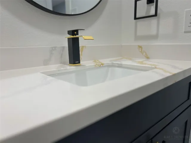 a view of a chair and table in backyard of the house