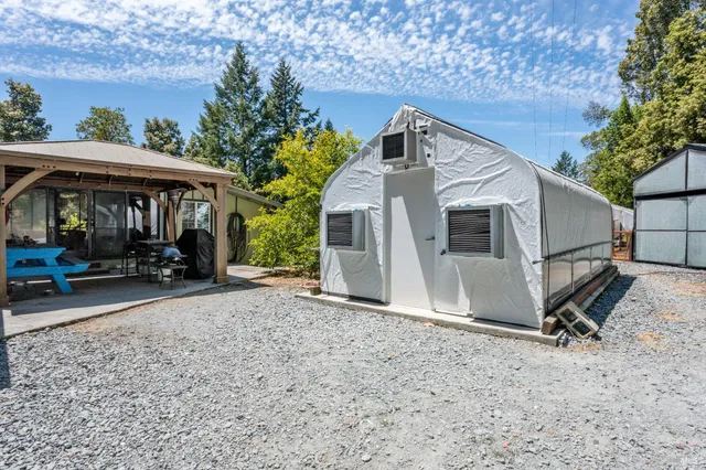 a view of a car park in front of a house