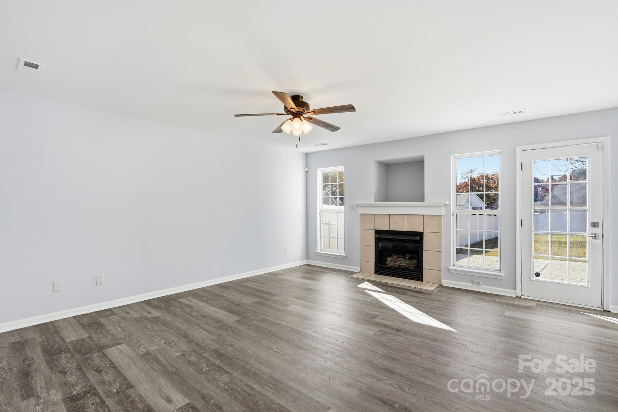 1505 Bellridge Road Rock Hill, SC 29732 - Photo 3 of 48 an empty room with fireplace fan and windows