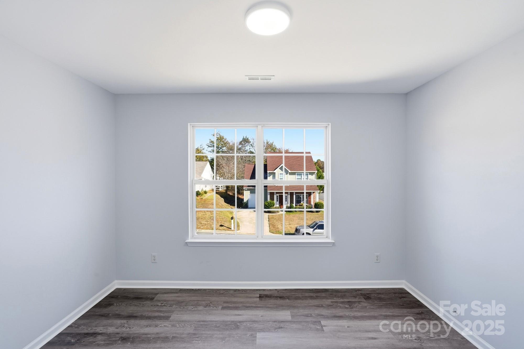 1505 Bellridge Road Rock Hill, SC 29732 - Photo 37 of 48 a view of an empty room with wooden floor and a window