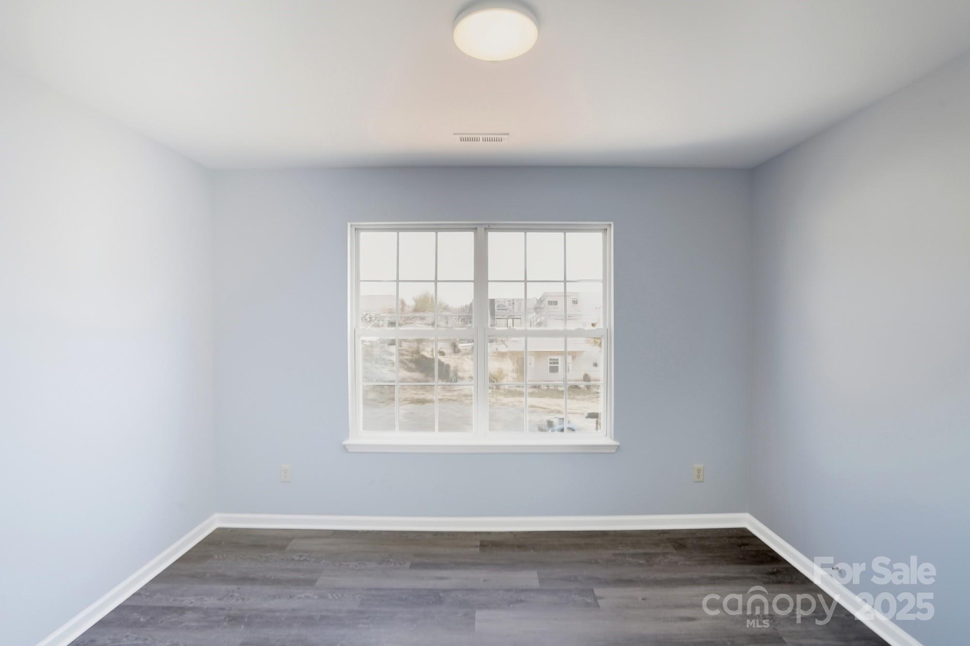 1505 Bellridge Road Rock Hill, SC 29732 - Photo 38 of 48 an empty room with wooden floor and windows