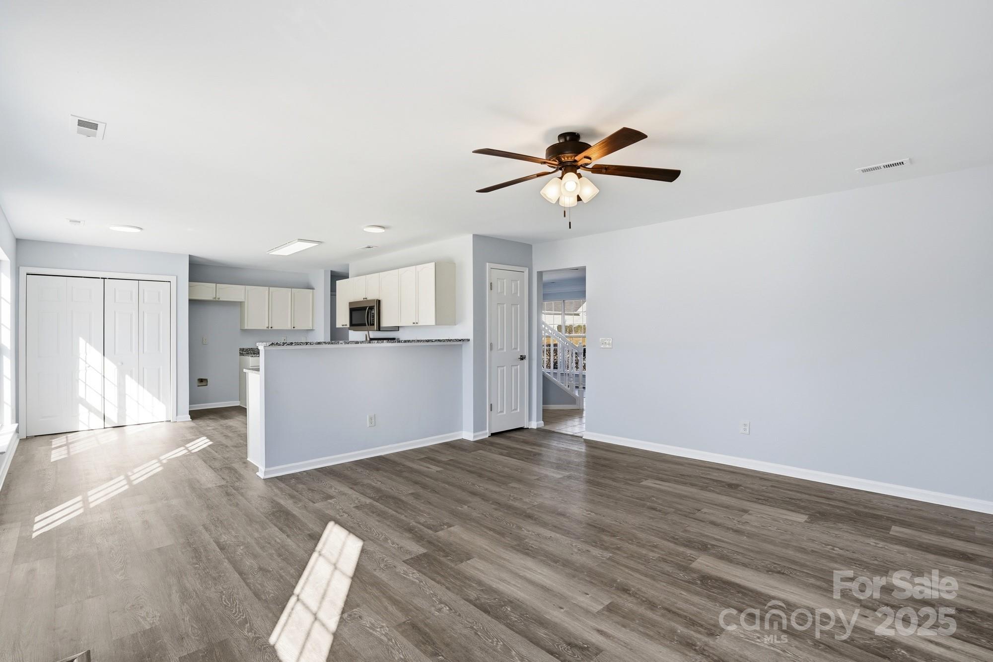 1505 Bellridge Road Rock Hill, SC 29732 - Photo 5 of 48 a view of a kitchen with microwave and a ceiling fan