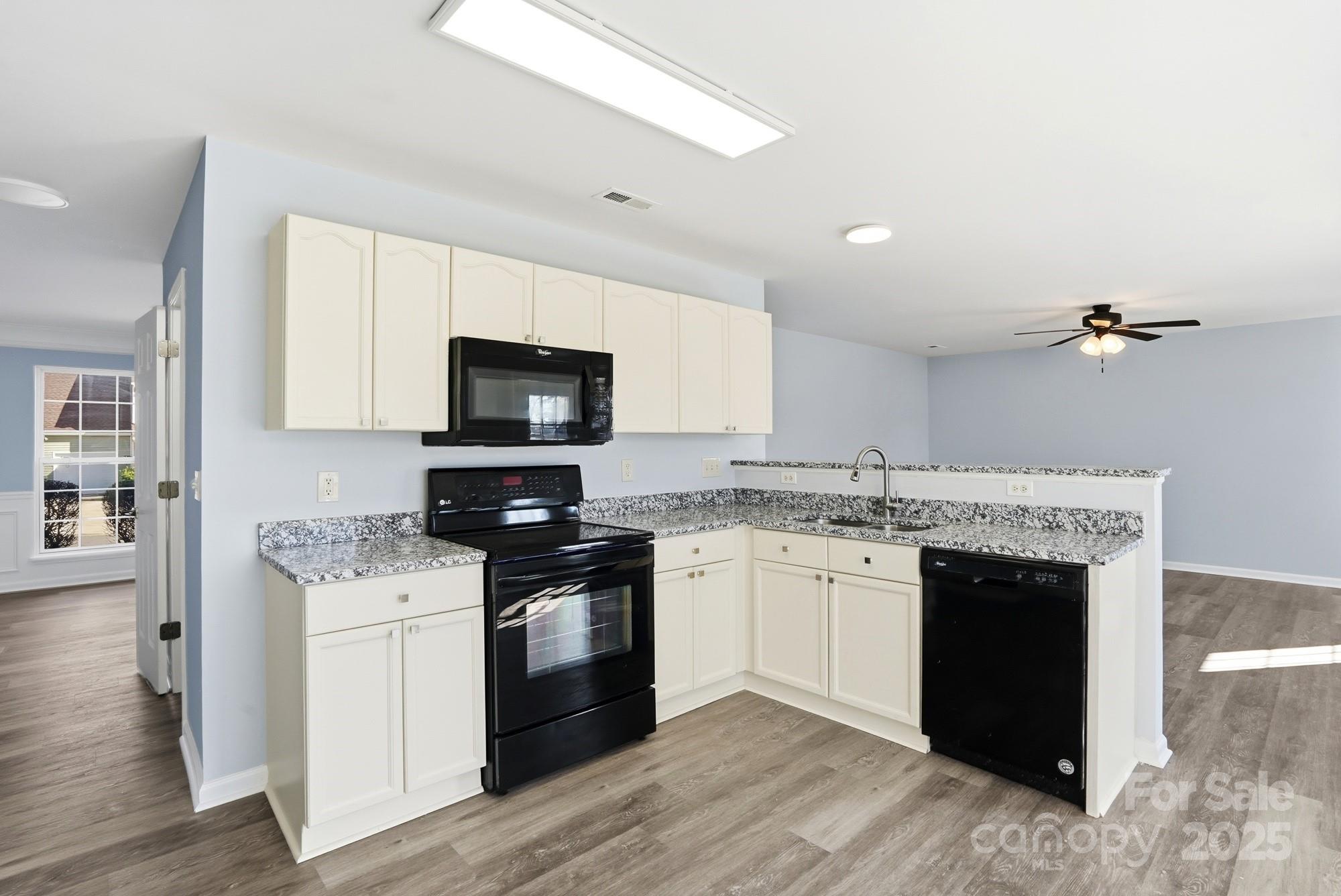 1505 Bellridge Road Rock Hill, SC 29732 - Photo 8 of 48 a kitchen with granite countertop a stove top oven and sink