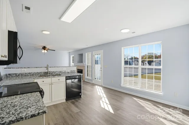 a view of bedroom with wooden floor and cabinet
