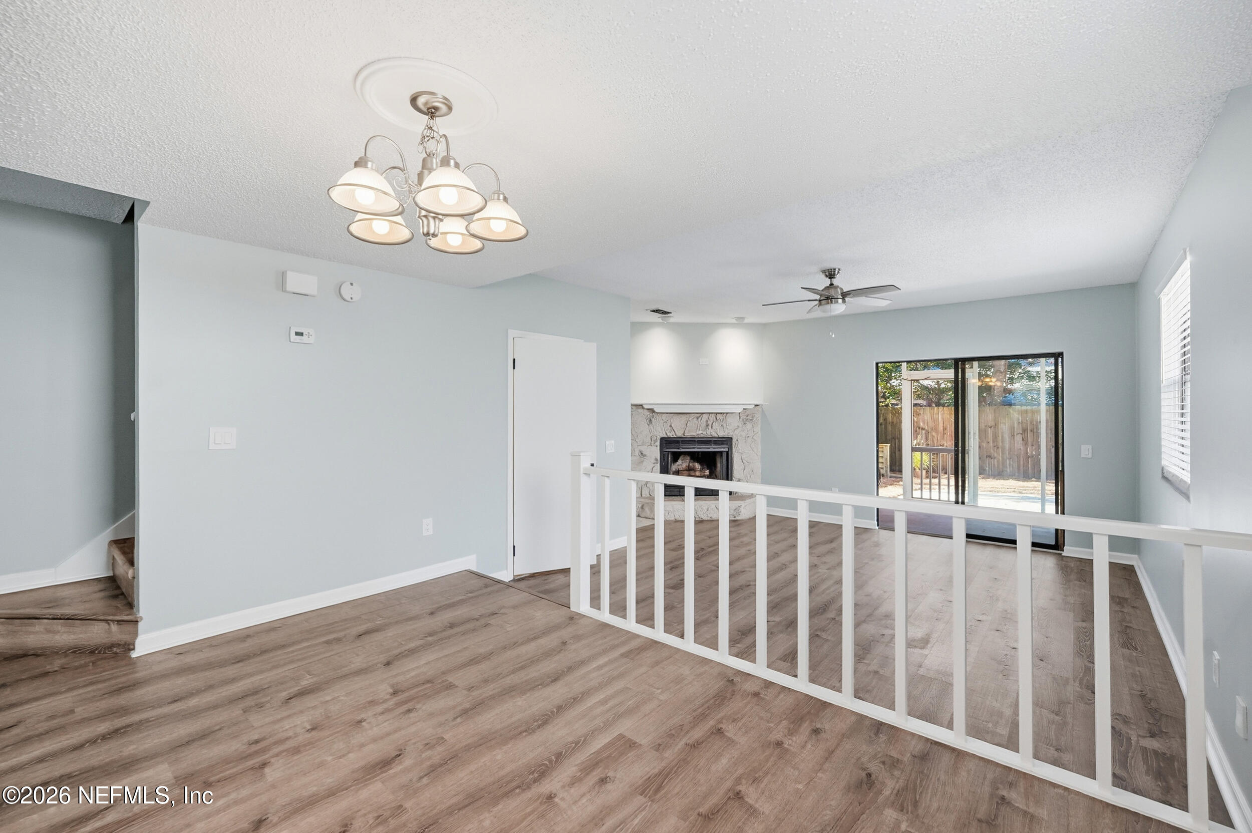 144 Poinsettia Street Atlantic Beach, FL 32233 - Photo 12 of 42 an empty room with wooden floor and windows