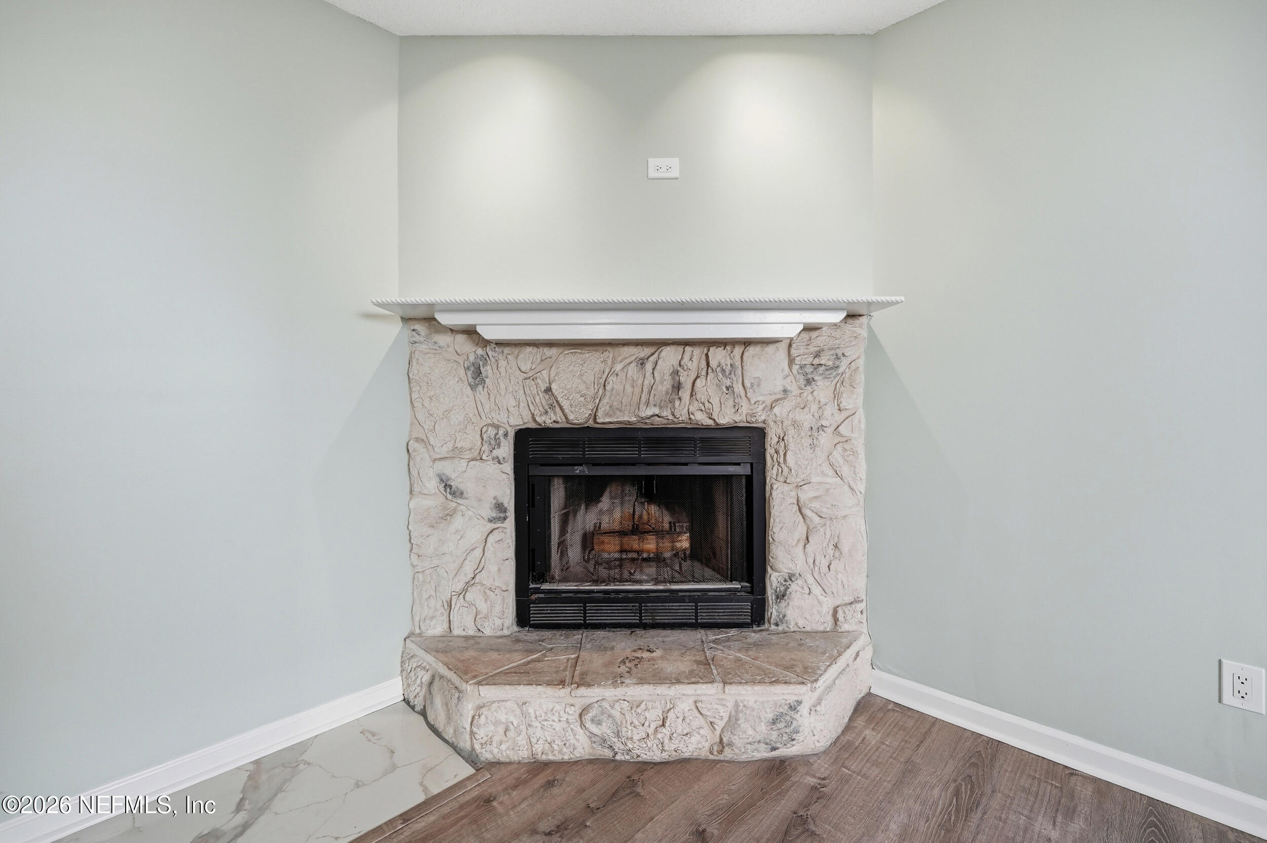 144 Poinsettia Street Atlantic Beach, FL 32233 - Photo 14 of 42 a living room with a fireplace