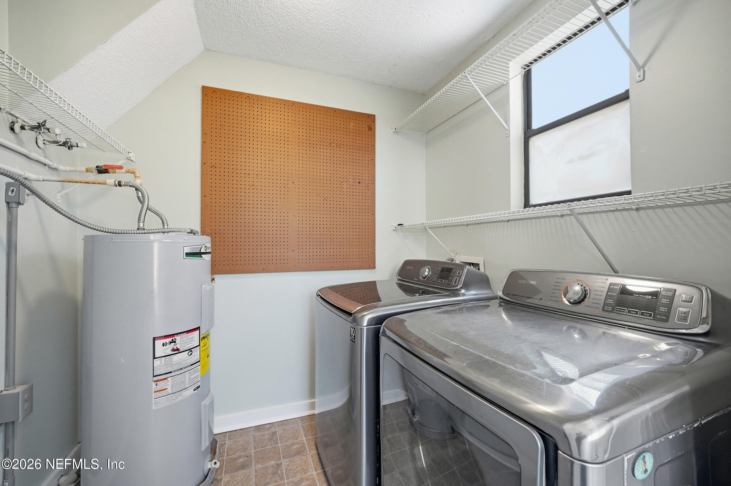 144 Poinsettia Street Atlantic Beach, FL 32233 - Photo 17 of 42 a utility room with dryer and washer