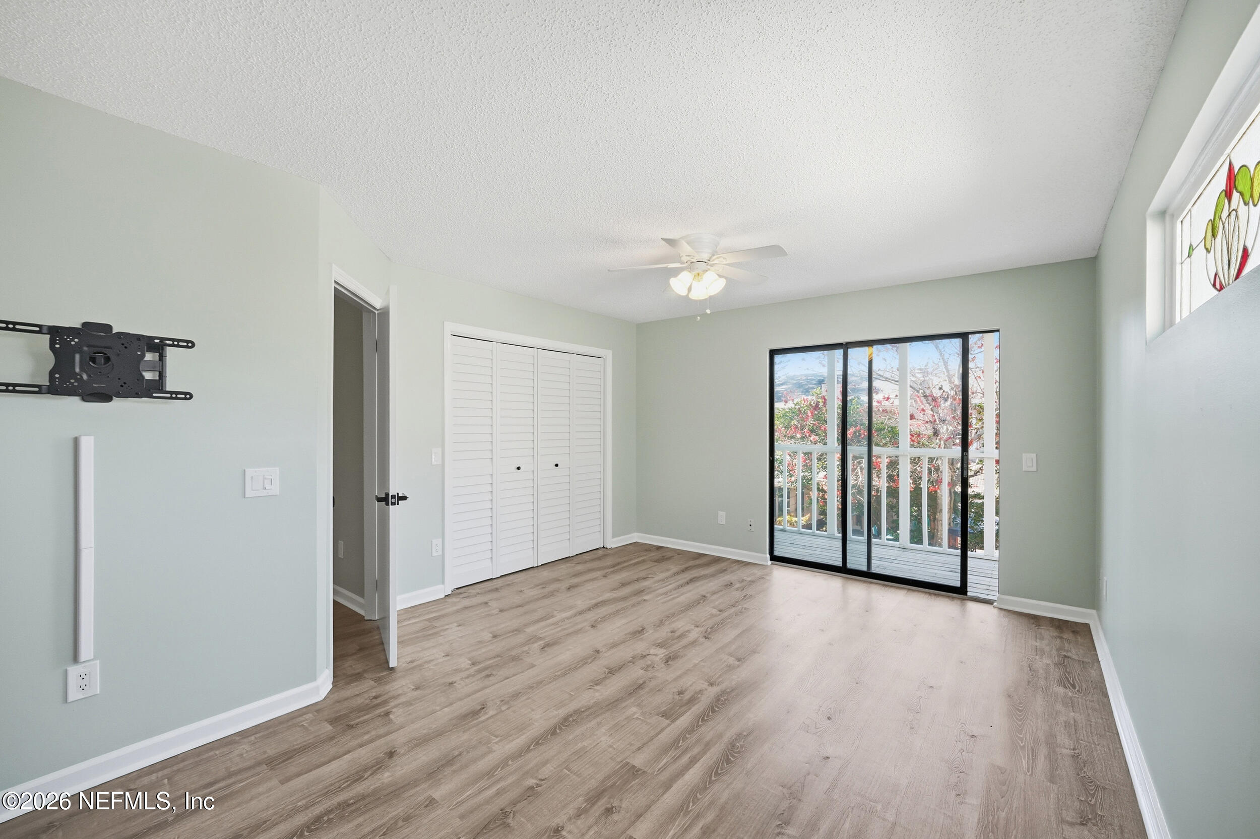 144 Poinsettia Street Atlantic Beach, FL 32233 - Photo 24 of 42 wooden floor in an empty room with a window