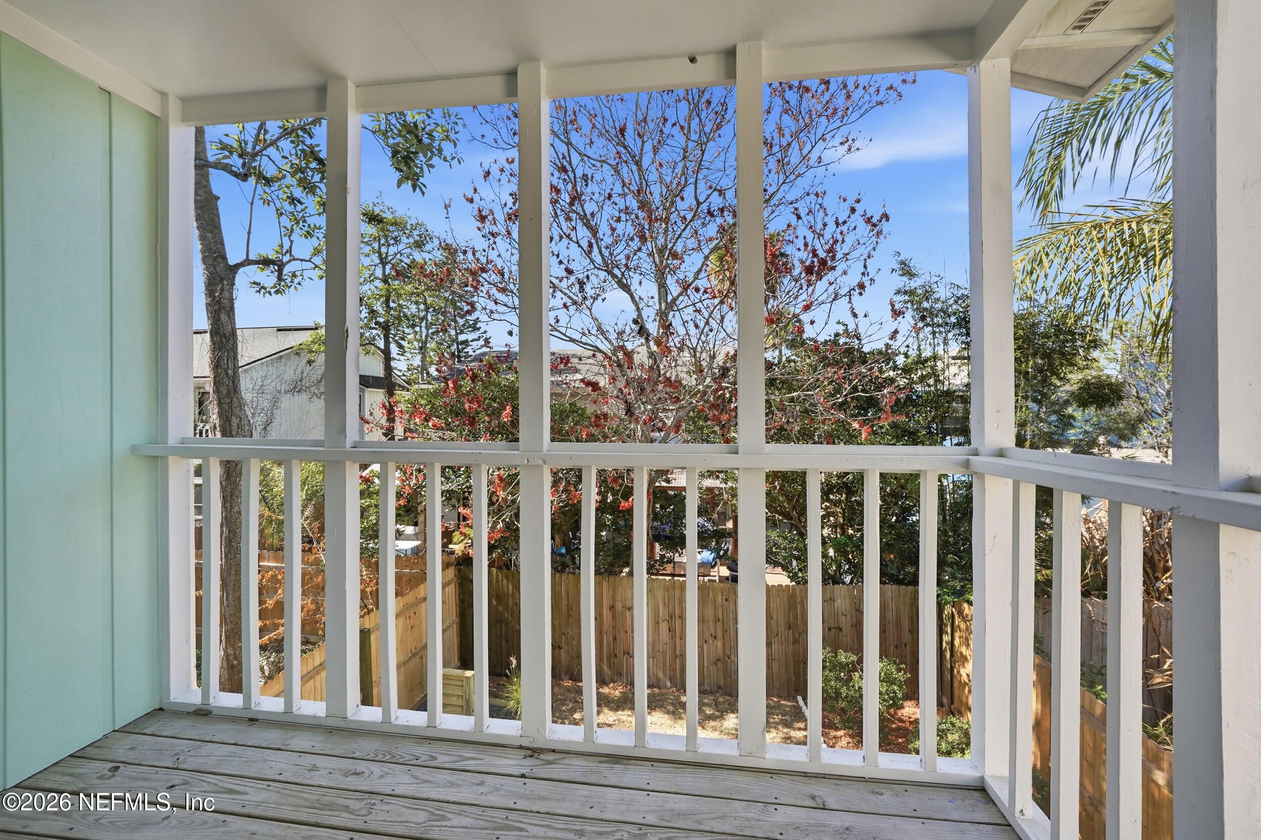 144 Poinsettia Street Atlantic Beach, FL 32233 - Photo 25 of 42 a view of a balcony with wooden floor and fence
