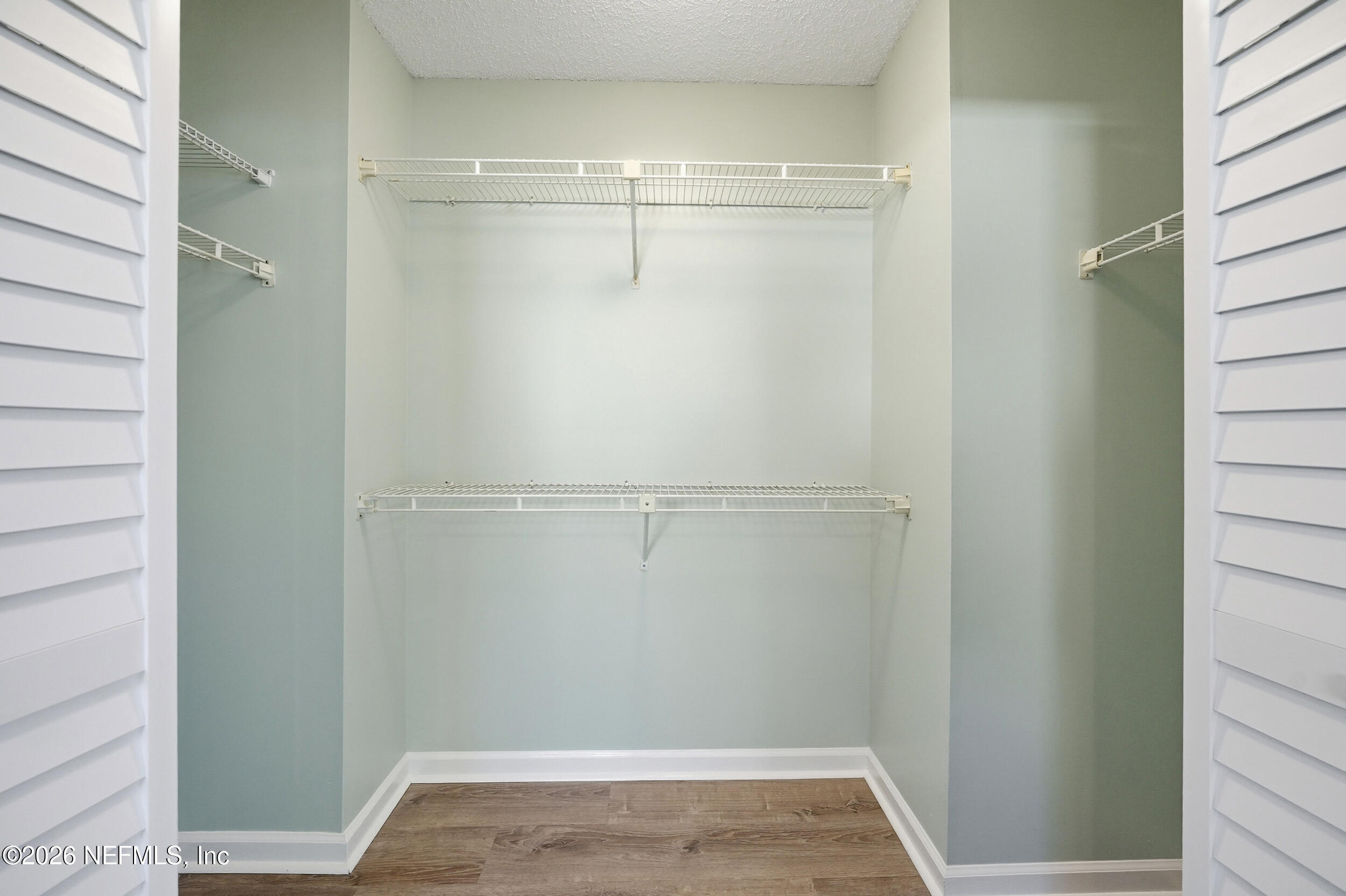 144 Poinsettia Street Atlantic Beach, FL 32233 - Photo 27 of 42 a view of a room with racks on the wall