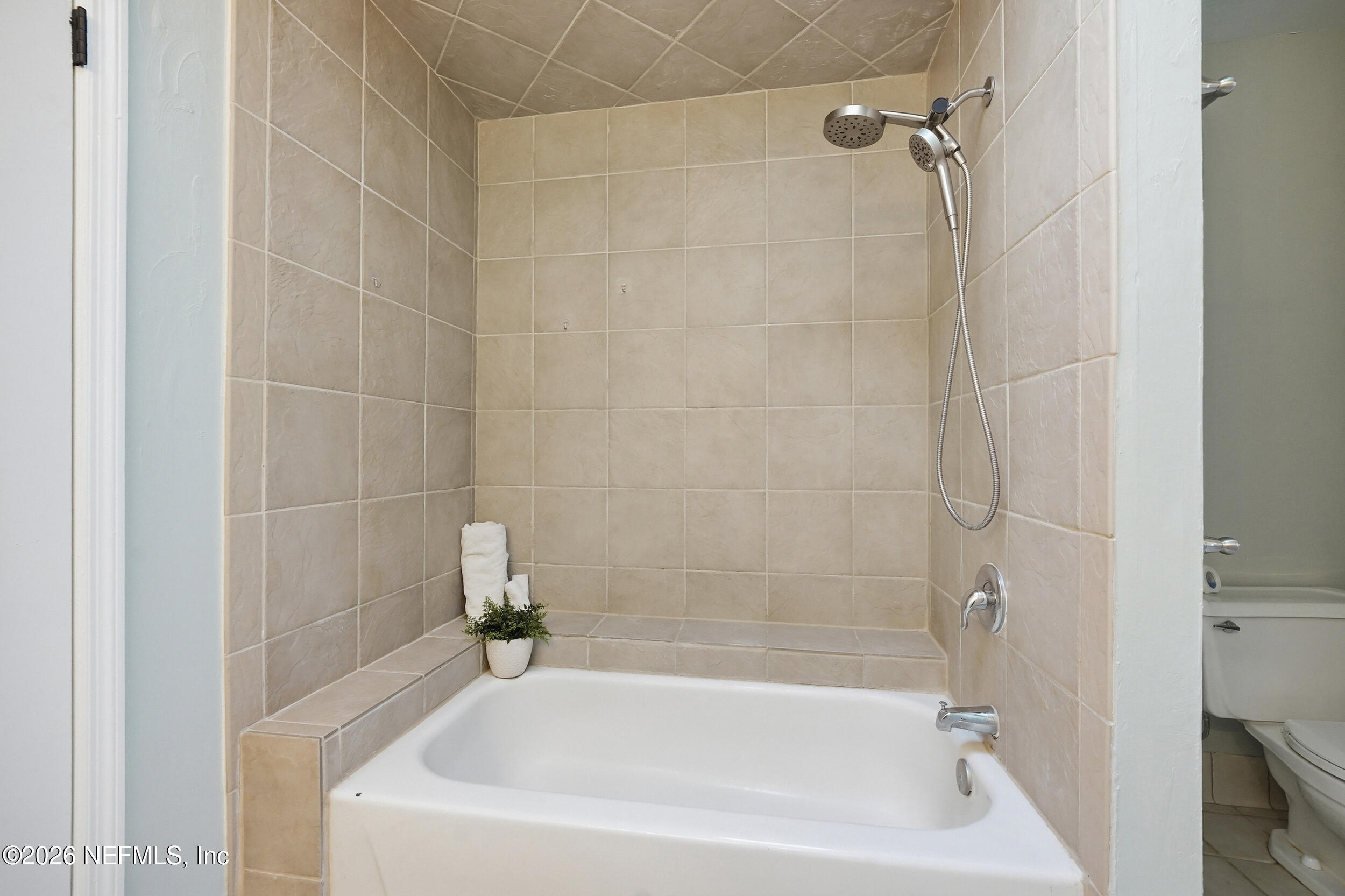 144 Poinsettia Street Atlantic Beach, FL 32233 - Photo 29 of 42 a white bath tub sitting next to a white sink