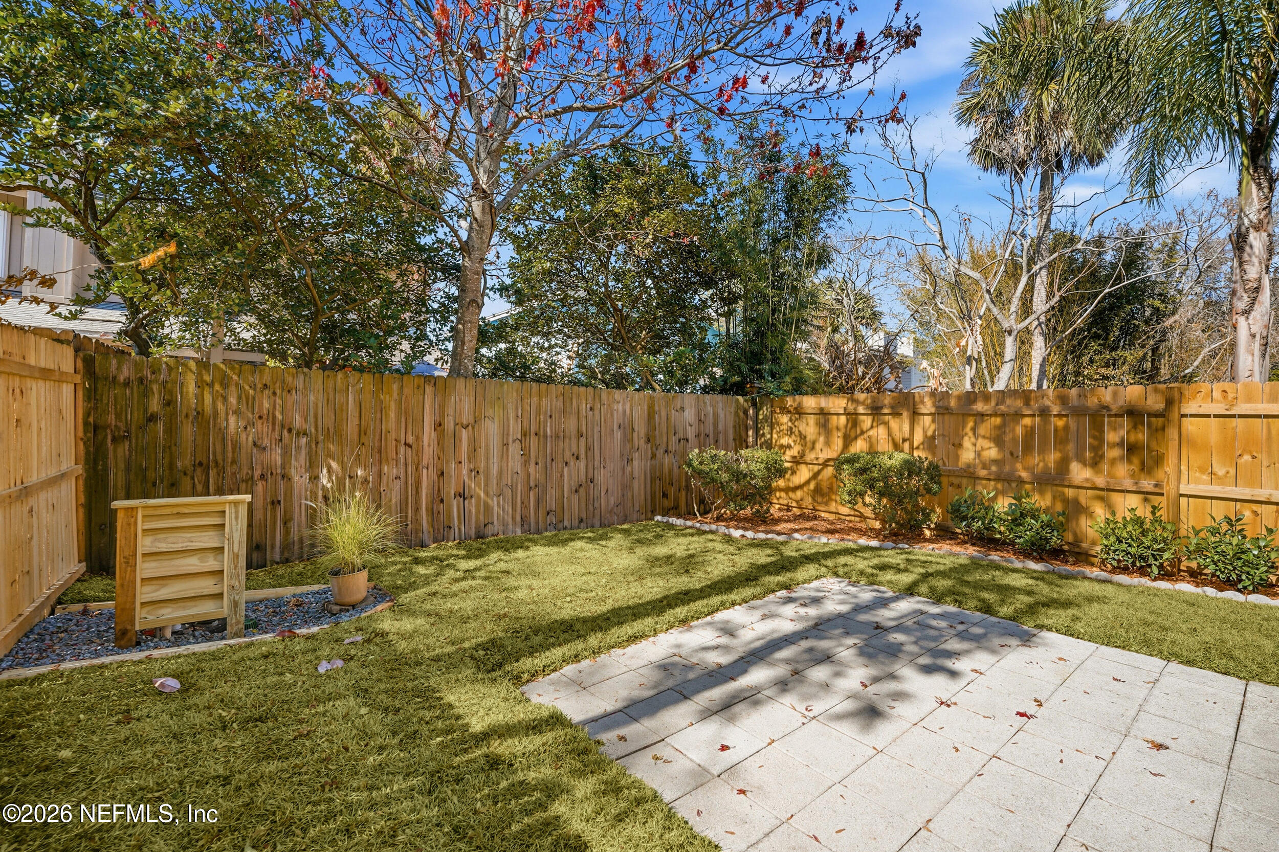 144 Poinsettia Street Atlantic Beach, FL 32233 - Photo 34 of 42 a backyard of a house with lots of green space