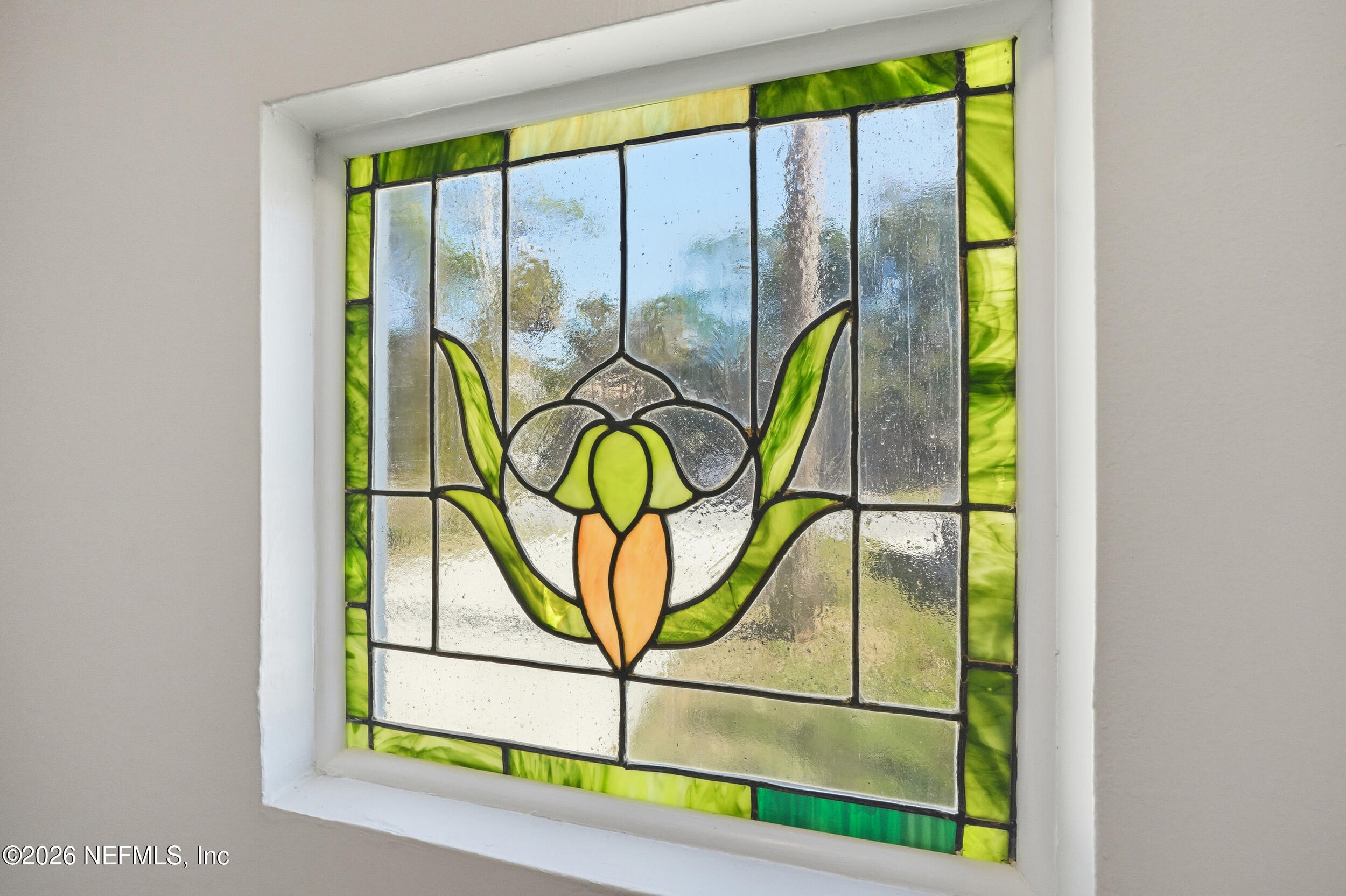144 Poinsettia Street Atlantic Beach, FL 32233 - Photo 5 of 42 wooden floor with a yellow plant in front of a window