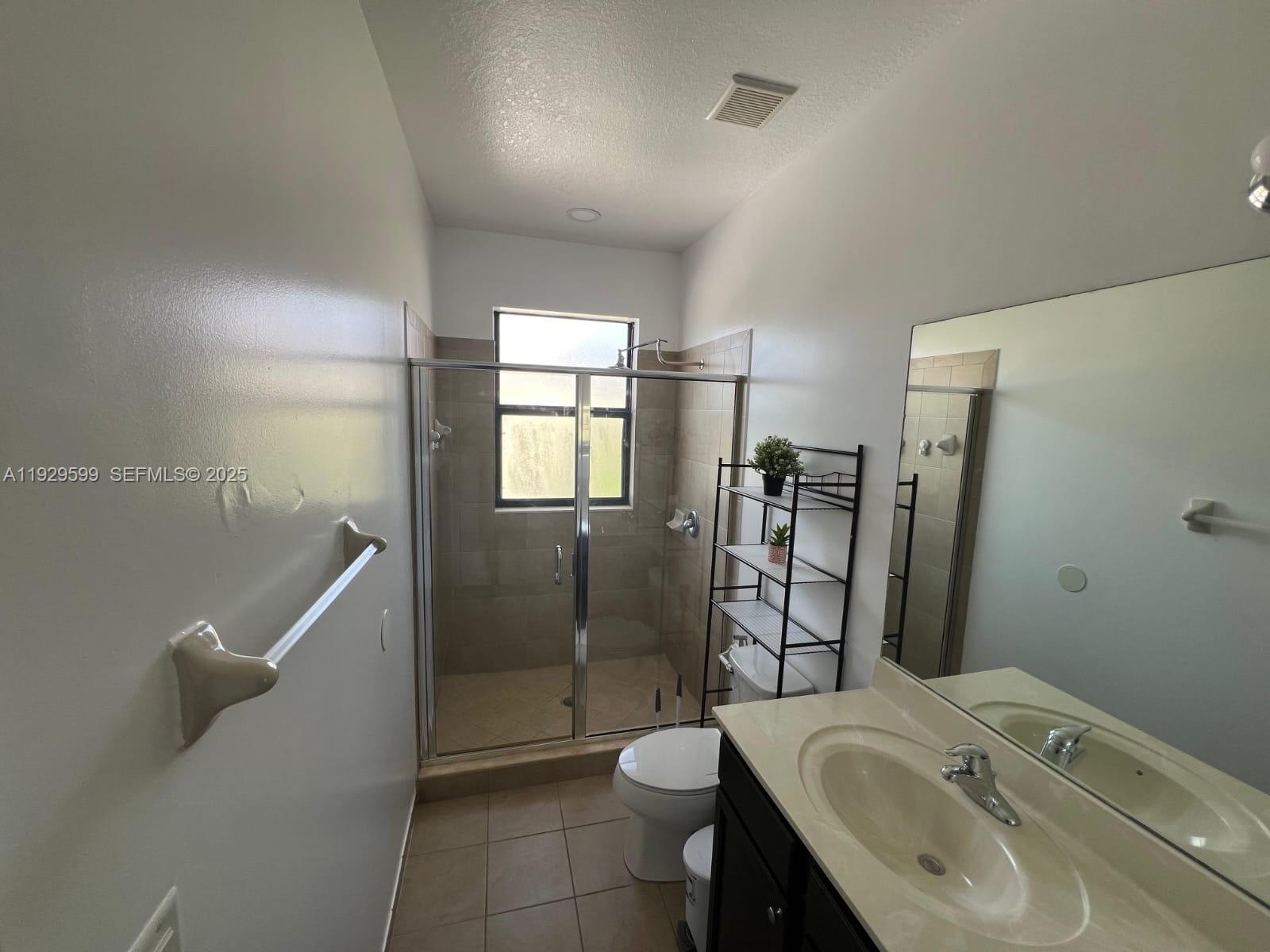 3399 West 90th Terrace Hialeah, FL 33018 - Photo 16 of 59 a bathroom with a sink toilet and shower