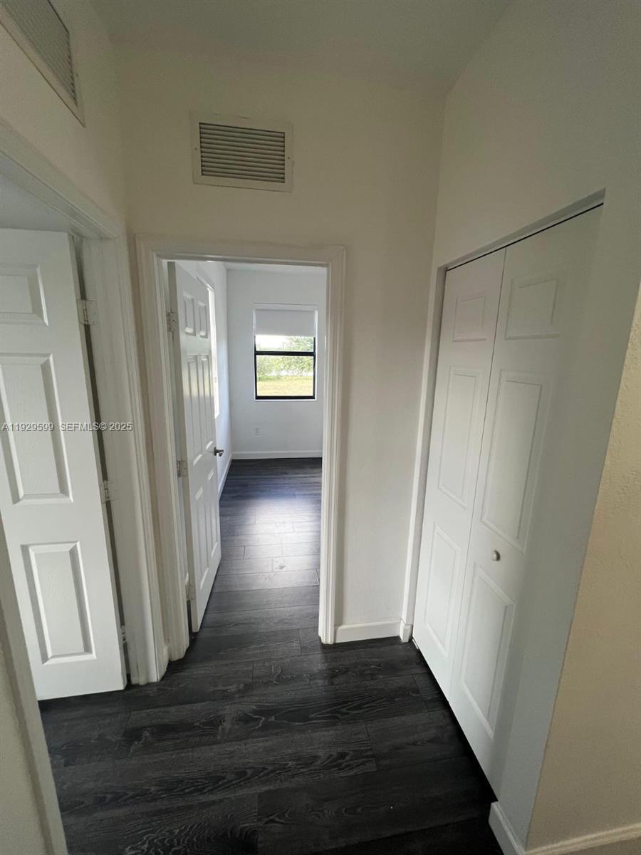 3399 West 90th Terrace Hialeah, FL 33018 - Photo 32 of 59 a view of entryway with wooden floor