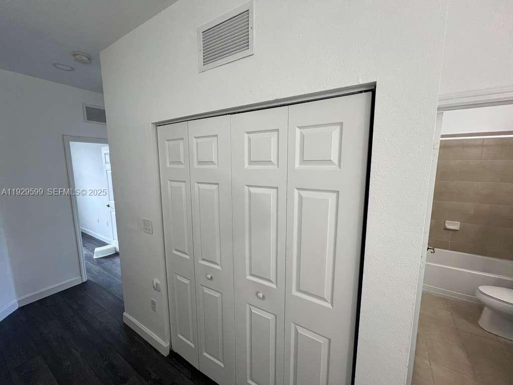 3399 West 90th Terrace Hialeah, FL 33018 - Photo 40 of 59 a view of entryway with wooden floor