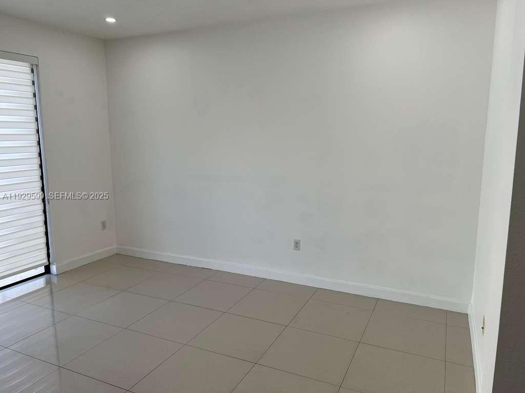 3399 West 90th Terrace Hialeah, FL 33018 - Photo 41 of 59 an empty room with a bathroom