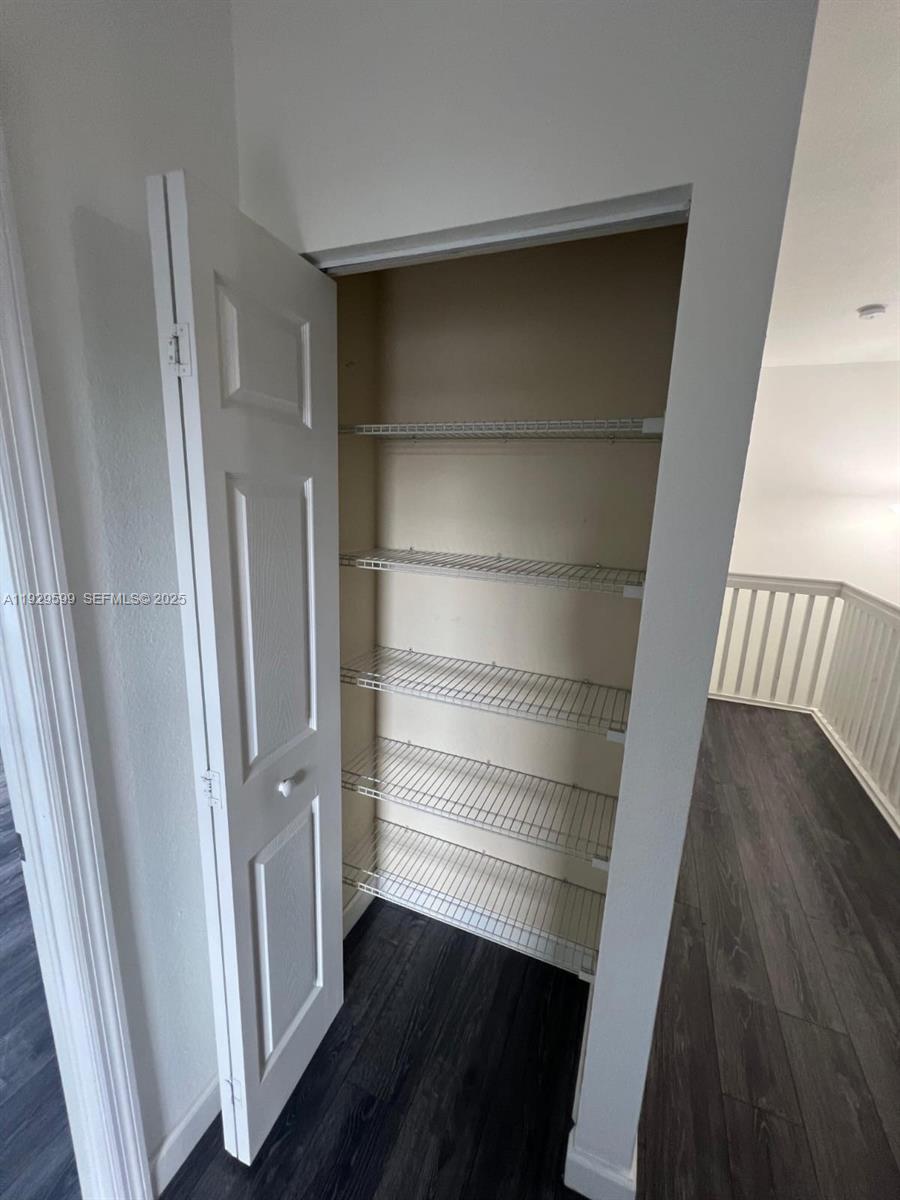 3399 West 90th Terrace Hialeah, FL 33018 - Photo 43 of 59 a view of walk in closet with empty racks