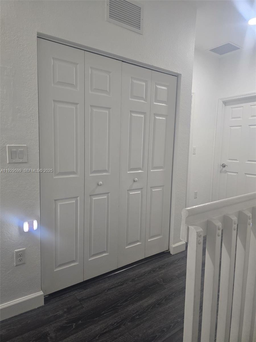 3399 West 90th Terrace Hialeah, FL 33018 - Photo 47 of 59 a view of a livingroom with wooden floor