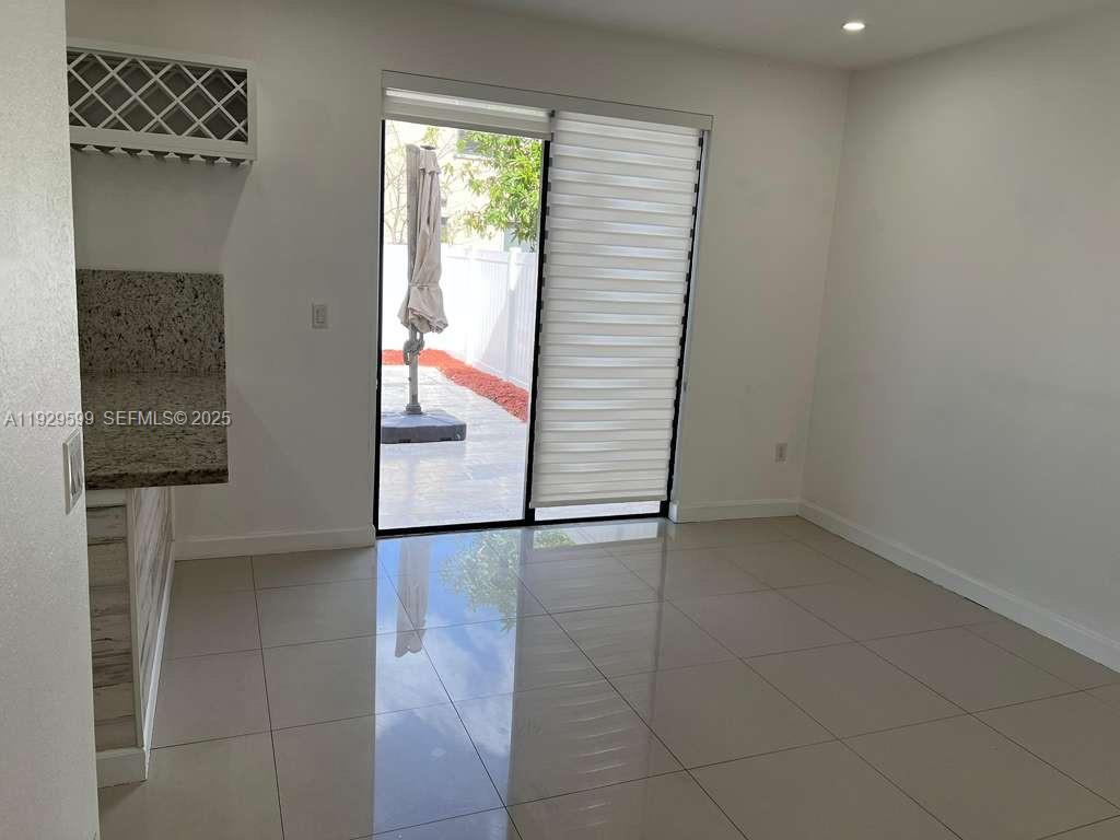3399 West 90th Terrace Hialeah, FL 33018 - Photo 49 of 59 a view of hallway with a door and a window