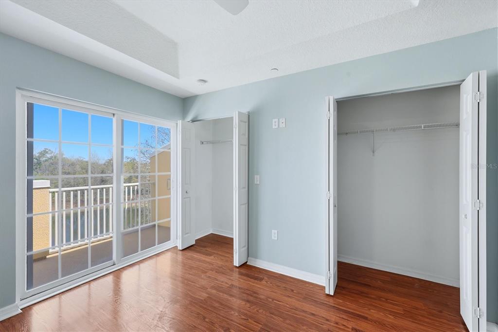 9038 White Sage Loop Lakewood Ranch, FL 34202 - Photo 22 of 52 a view of wooden floor and windows in a room