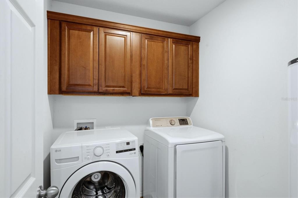 9038 White Sage Loop Lakewood Ranch, FL 34202 - Photo 32 of 52 a utility room with dryer and washer